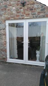 a glass door with a vase in front of it at Annie's in Carlisle