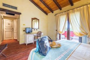Postel nebo postele na pokoji v ubytování Hotel Sa Contonera