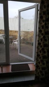 a sliding glass door with a view of a patio at Annie's in Carlisle