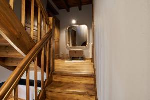 a hallway with a staircase with a large mirror at PRECIOSA CASA, NAUT ARAN, ALTO ARAN, GESSA, A 4 KM DE BAQUEIRA, 212 M2 wifi in Gessa +27 photos