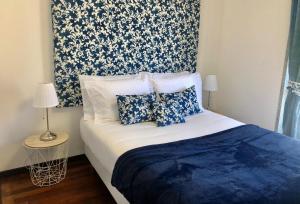 Uma cama ou camas num quarto em Alojamento Local S. Bartolomeu