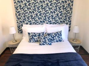 Uma cama ou camas num quarto em Alojamento Local S. Bartolomeu