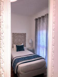 Uma cama ou camas num quarto em Alojamento Local S. Bartolomeu