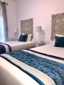 Uma cama ou camas num quarto em Alojamento Local S. Bartolomeu