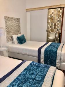 Uma cama ou camas num quarto em Alojamento Local S. Bartolomeu