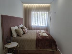 Suite na baixa do Porto tesisinde bir odada yatak veya yataklar