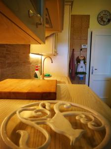 a bed with a wooden design on top of it at VISTA PANORAMICA in Castiglione della Pescaia