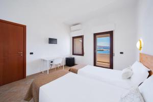 Postel nebo postele na pokoji v ubytování Il Gabbiano