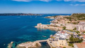 an aerial view of a town on the water at Hotel Il Gabbiano in La Maddalena