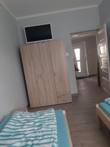 A bed or beds in a room at ALFA Szálláshely