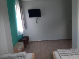 A television and/or entertainment centre at ALFA Szálláshely