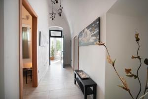 A television and/or entertainment centre at WePuglia La Maison-D B&B