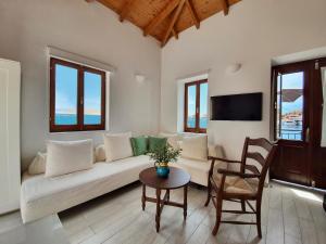 a living room with a couch and a table at Aegean View Villas in Halki