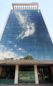 a glass building with the words new utrecht hotel at Niyat Urban Hotel in Resistencia