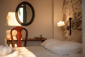 
a bedroom with a mirror and a bed at Beautiful City Suites in Athens
