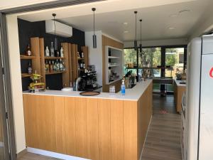 a bar in a kitchen with a counter at Daria Essence in Limenas