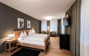 Ein Bett oder Betten in einem Zimmer der Unterkunft Boutique & Gourmet Hotel Orso Grigio