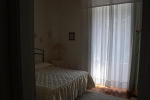 Posteľ alebo postele v izbe v ubytovaní Casa Mariannina