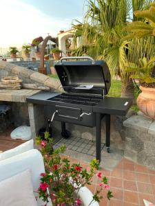 a black piano sitting on a table on a patio at Dimorra Sun and Relax in Ischia