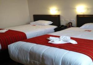 Postel nebo postele na pokoji v ubytování Hotel Don Sam