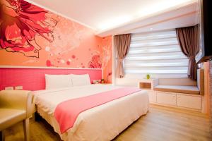Postel nebo postele na pokoji v ubytování 墾丁合歡8宿-Ho Huan B & B