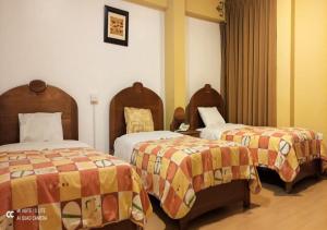 Postel nebo postele na pokoji v ubytování Hotel Don Sam