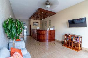 a living room with a couch and a table at Hotel Casa Garatusa in Yuriria
