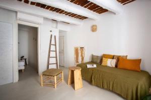 a room with a bed and a ladder and a stool at Vieil Antibes, plage de sable, avec parking in Antibes