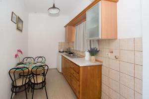 Kuchyň nebo kuchyňský kout v ubytování Spiros and Polyxeni Apartments Afionas