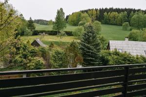 a view of a garden from a fence at Apartmány u kostela in Lipova Lazne