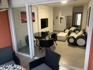 a living room with a couch and a table at Apartamento "Pedro" 250 m de la playa in Gandía