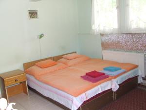 Кровать или кровати в номере Prima Pihenő