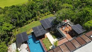 an aerial view of solar panels on a house at Panther Bay Boutique Hotel in Akumal
