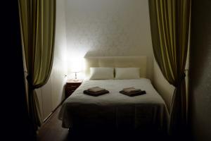 Säng eller sängar i ett rum på Апартаменты в Одессе