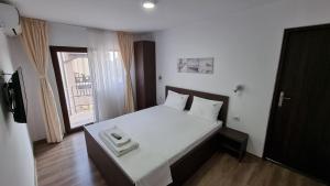 Ένα ή περισσότερα κρεβάτια σε δωμάτιο στο Casa Amy