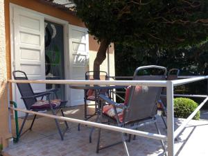 a table and chairs sitting on a patio at Király Apartman in Fonyód