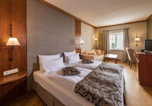Postel nebo postele na pokoji v ubytování Berghotel Eisenach + 27 fotografií