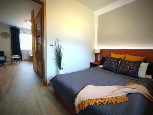 Postel nebo postele na pokoji v ubytování LAGO Apartamenty i pokoje
