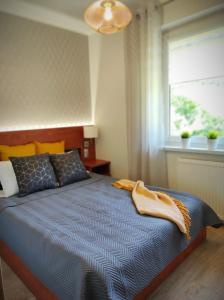 Postel nebo postele na pokoji v ubytování LAGO Apartamenty i pokoje