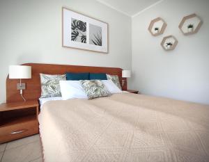 Postel nebo postele na pokoji v ubytování LAGO Apartamenty i pokoje
