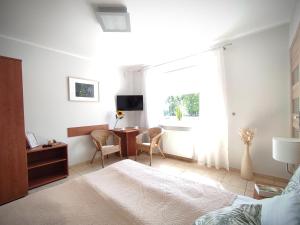TV a/nebo společenská místnost v ubytování LAGO Apartamenty i pokoje