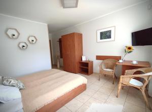 TV a/nebo společenská místnost v ubytování LAGO Apartamenty i pokoje