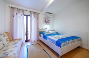 Posteľ alebo postele v izbe v ubytovaní Stela Apartments