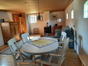 a living room with a table and chairs at Ferienhaus Vörn-Diek in Hohnstorf