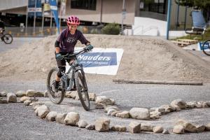 a young boy riding a bike over rocks at VALRUNZHOF direkt am SEILBAHNCENTER in Nauders +26 photos