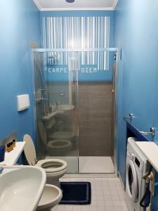 a bathroom with a shower with a toilet and a sink at BlueYellow home in Cannaregio Air conditioning WiFi in Venice