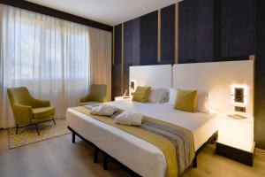 Postel nebo postele na pokoji v ubytování Savhotel Fiera Bologna
