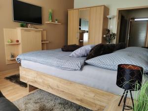 Posteľ alebo postele v izbe v ubytovaní Csabai Apartman