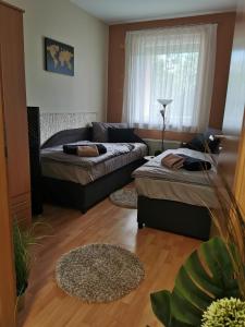 Posteľ alebo postele v izbe v ubytovaní Csabai Apartman