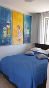 Łóżko lub łóżka w pokoju w obiekcie Impresja 42 Apartament z garażem